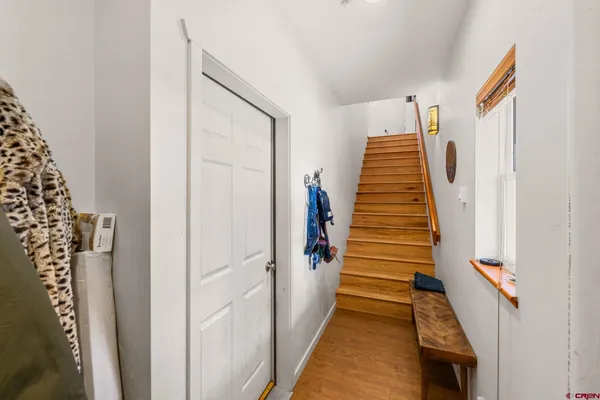 a view of a hallway with stairs
