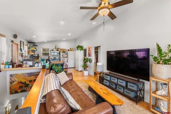 a living room with furniture and a flat screen tv