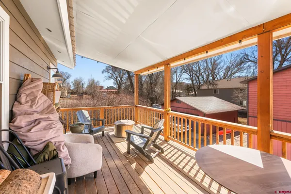 a view of balcony with furniture