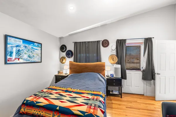 a bedroom with a bed and a table in it