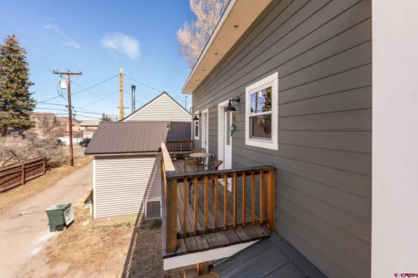 a front view of a house with wooden fence