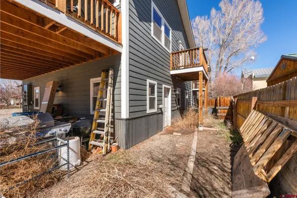 a view of a backyard with sitting area