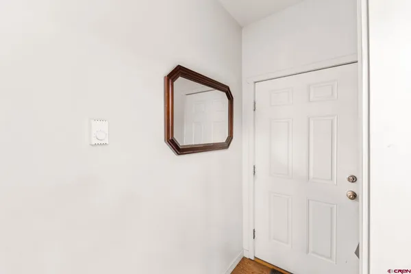 a bathroom with a mirror and a shower