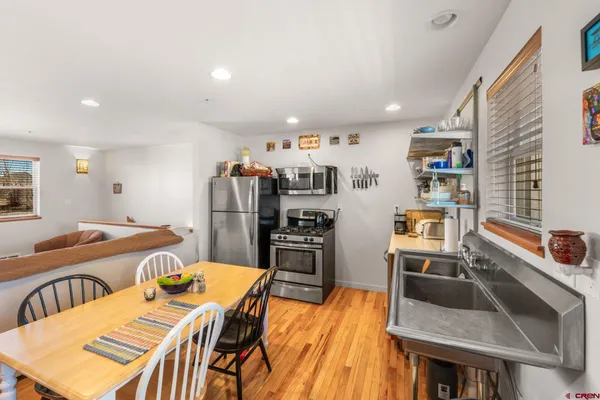 a bed room with a bed furniture and a flat screen tv