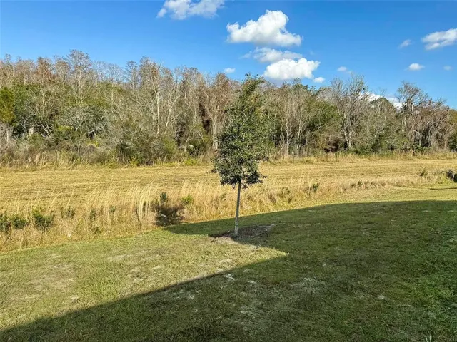 a view of pool with outdoor seating
