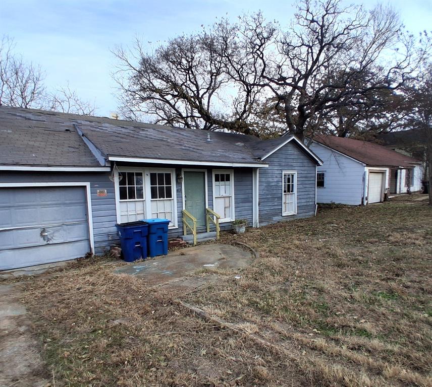 43 West Parnell Street Denison, TX 75020 - Photo 2 of 15 a view of a house with a yard and large tree