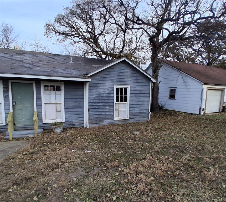 43 West Parnell Street Denison, TX 75020 - Photo 3 of 15 a house is sitting in middle of the forest