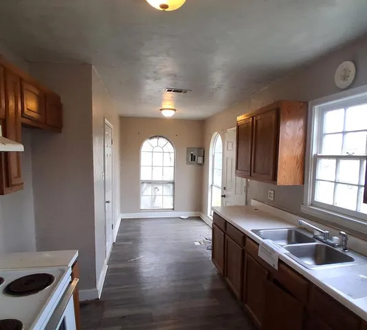 a large kitchen with a large window