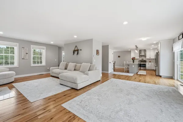 a view of a livingroom with furniture and a fireplace