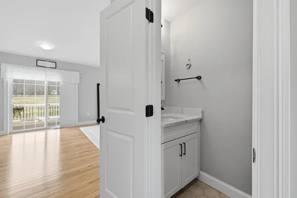 a kitchen with stainless steel appliances a refrigerator and wooden floor