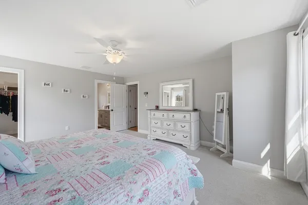 a bathroom with a sink double vanity and a toilet