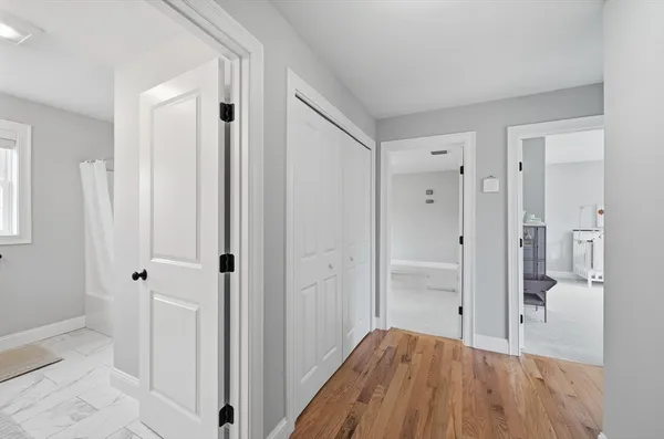 a bathroom with a sink toilet and window