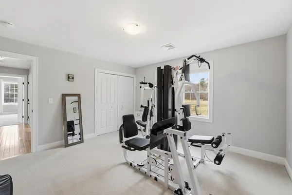 a bedroom with furniture and window