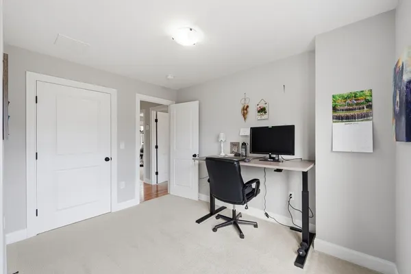 a view of living room with furniture and a window