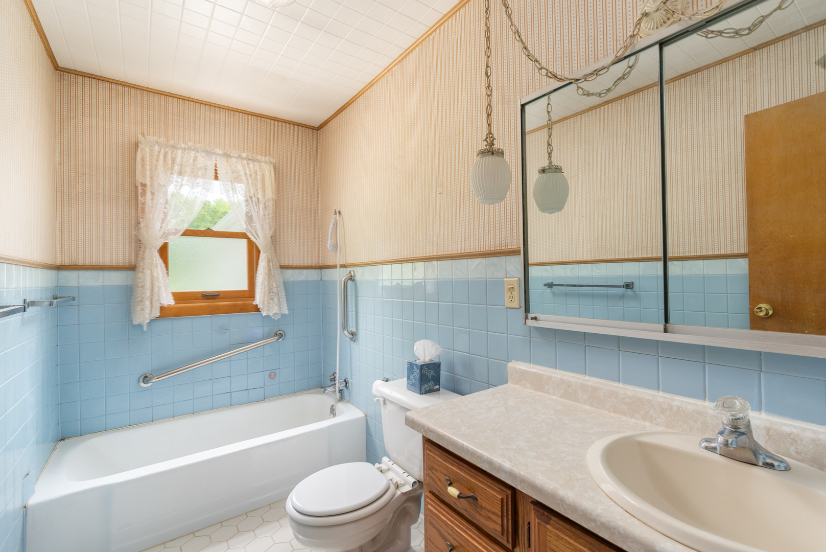 698 North 2853rd Road LaSalle, IL 61301 - Photo 18 of 39 a bathroom with a granite countertop sink a toilet a mirror and bathtub