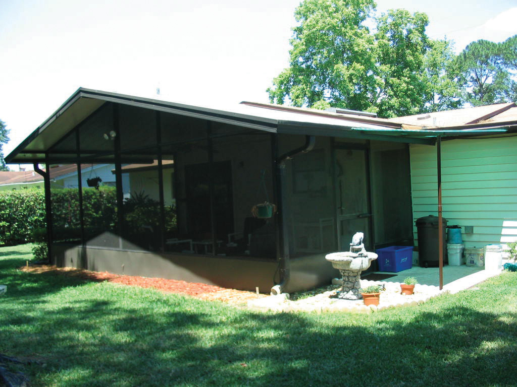 4212 Dayrl Road Jacksonville, FL 32207 - Photo 3 of 4 a view of backyard with a table and chairs under an umbrella