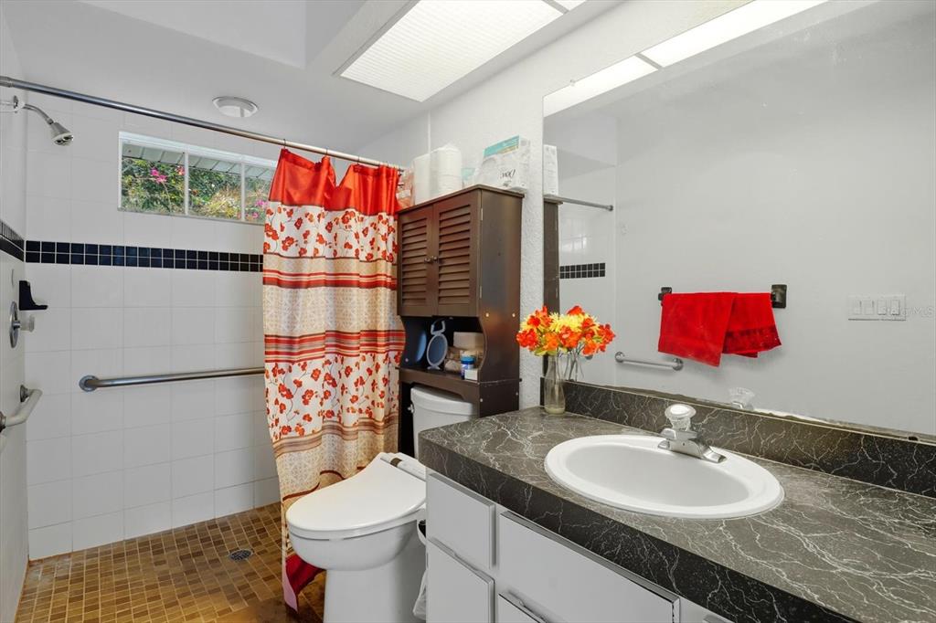 4355 West Justice Court Homosassa, FL 34446 - Photo 11 of 30 a bathroom with a sink vanity mirror and toilet