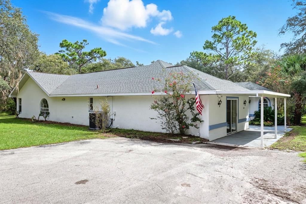 4355 West Justice Court Homosassa, FL 34446 - Photo 2 of 30 a view of a house with a patio