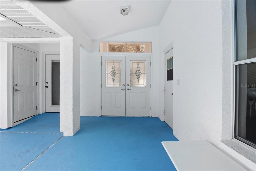 4355 West Justice Court Homosassa, FL 34446 - Photo 25 of 30 an empty room with wooden floor and windows