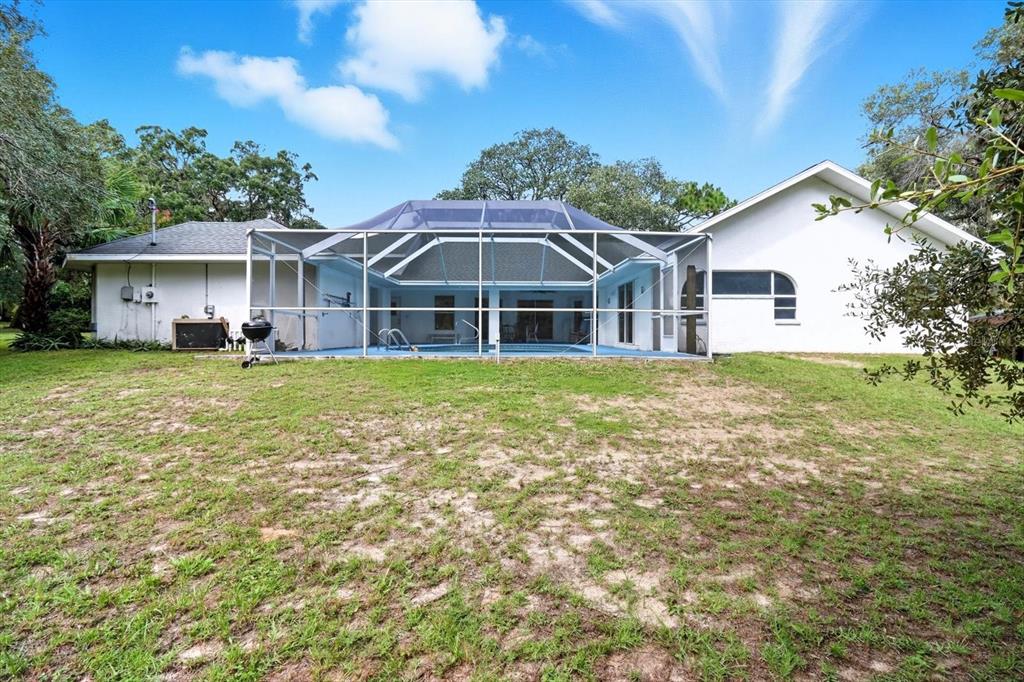 4355 West Justice Court Homosassa, FL 34446 - Photo 29 of 30 a view of a house with a yard