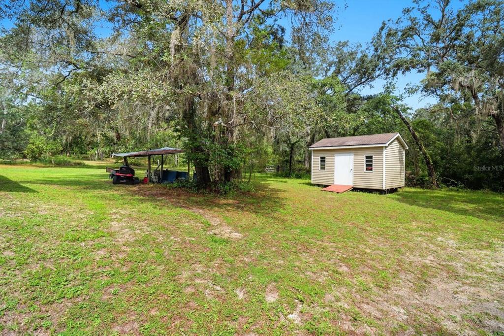 4355 West Justice Court Homosassa, FL 34446 - Photo 30 of 30 a front view of a house with a garden