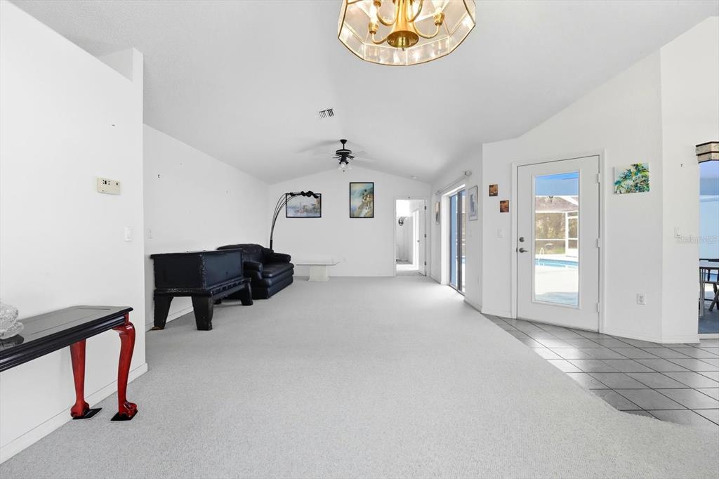 4355 West Justice Court Homosassa, FL 34446 - Photo 3 of 30 a view of livingroom with furniture and chandelier