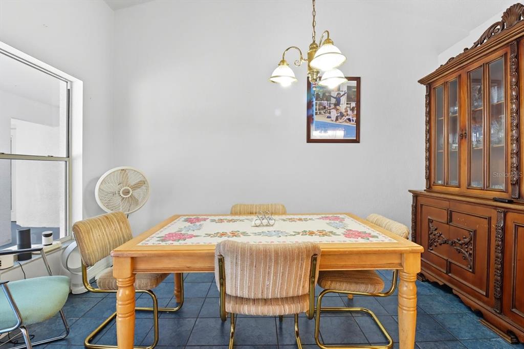 4355 West Justice Court Homosassa, FL 34446 - Photo 8 of 30 a view of a dining room with furniture window and wooden floor