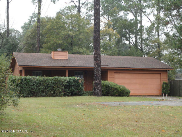 4624 Barnes Road South Jacksonville, FL 32207 - Photo 1 of 13 a view of a house with a yard and garage
