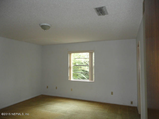 4624 Barnes Road South Jacksonville, FL 32207 - Photo 11 of 13 an empty room with a window