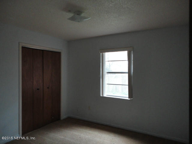 4624 Barnes Road South Jacksonville, FL 32207 - Photo 8 of 13 an empty room with a window