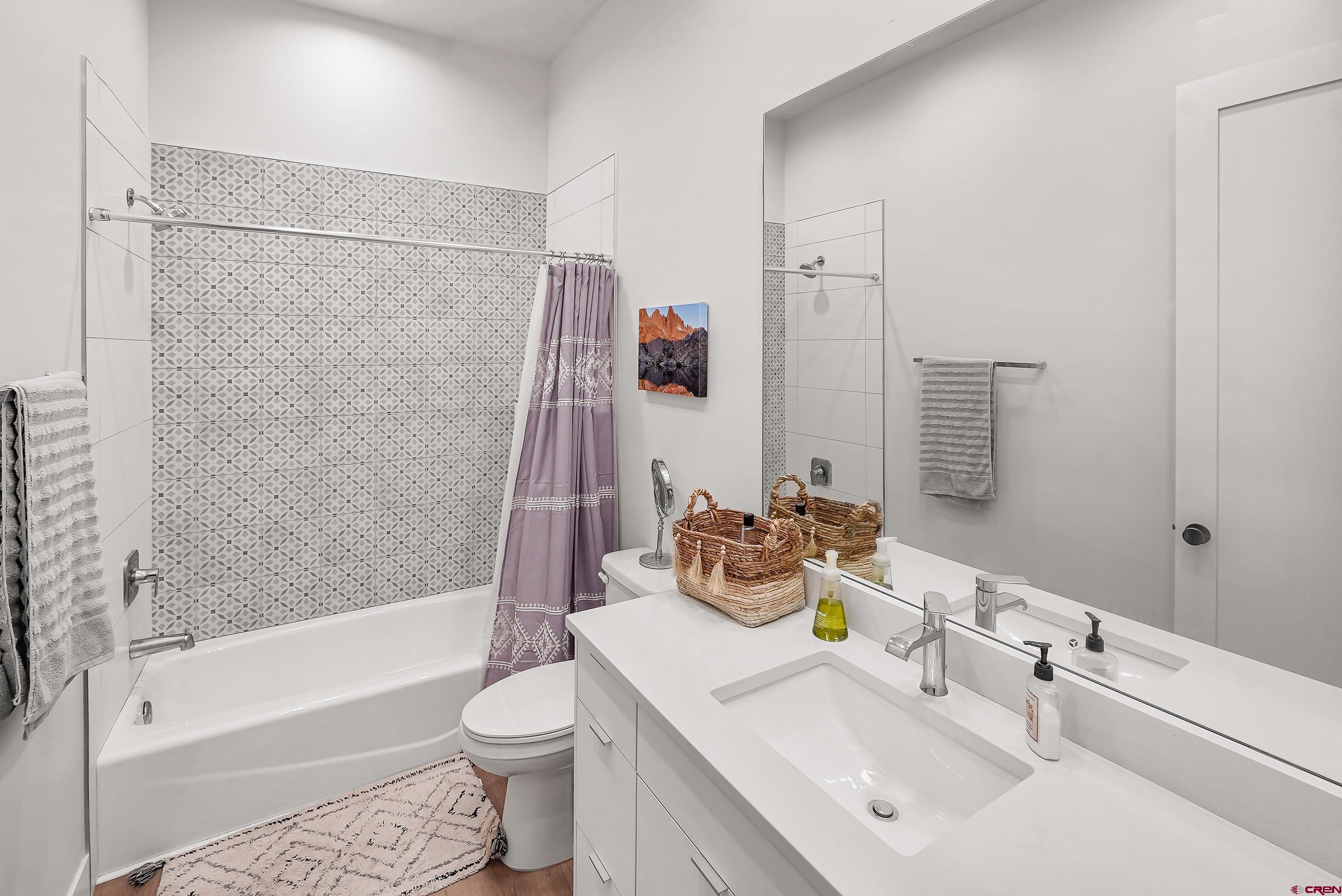 106 Elevation Drive Durango, CO 81303 - Photo 20 of 21 a bathroom with a sink toilet and shower