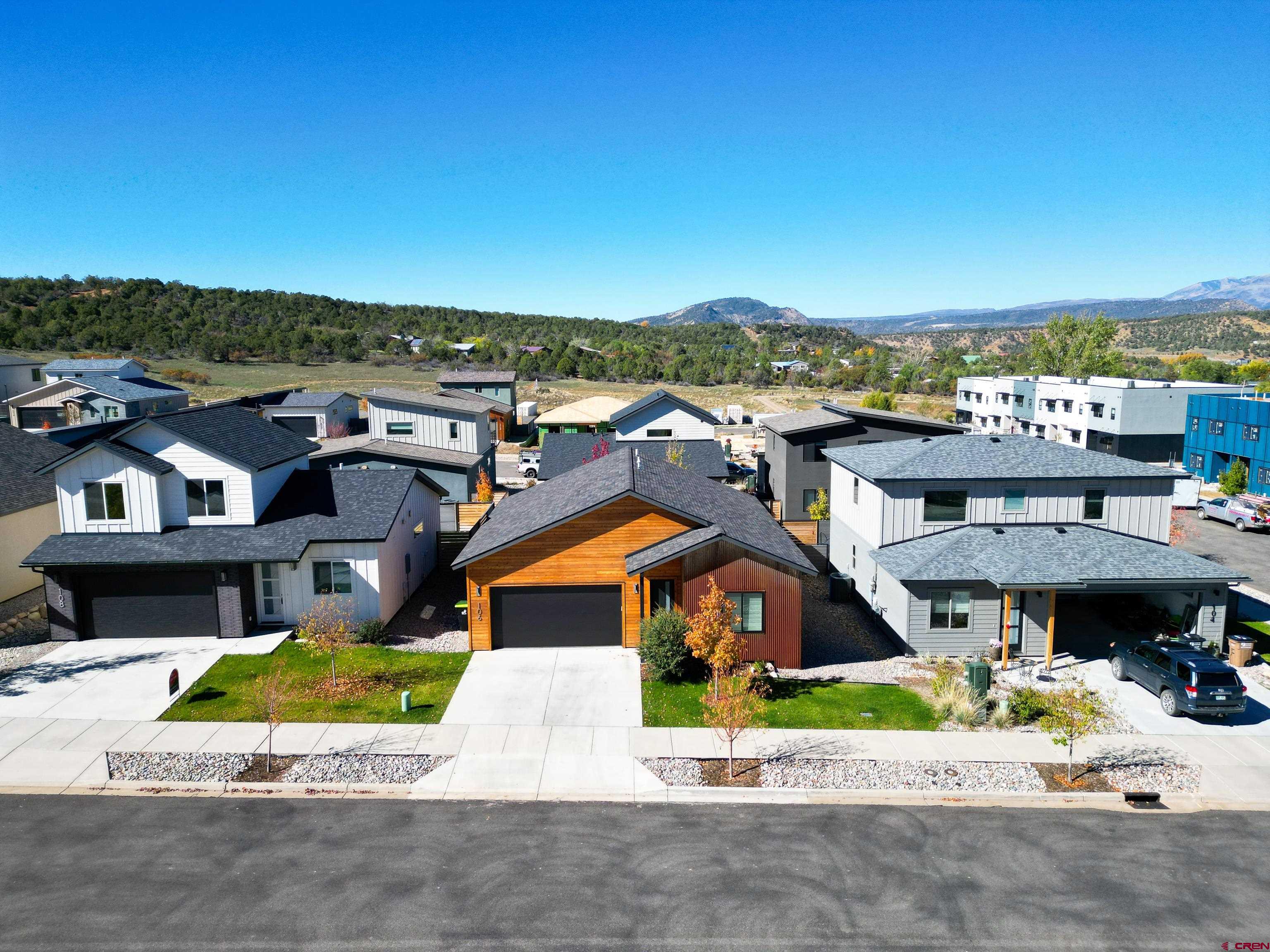 106 Elevation Drive Durango, CO 81303 - Photo 2 of 21 an aerial view of a house with a big yard and potted plants
