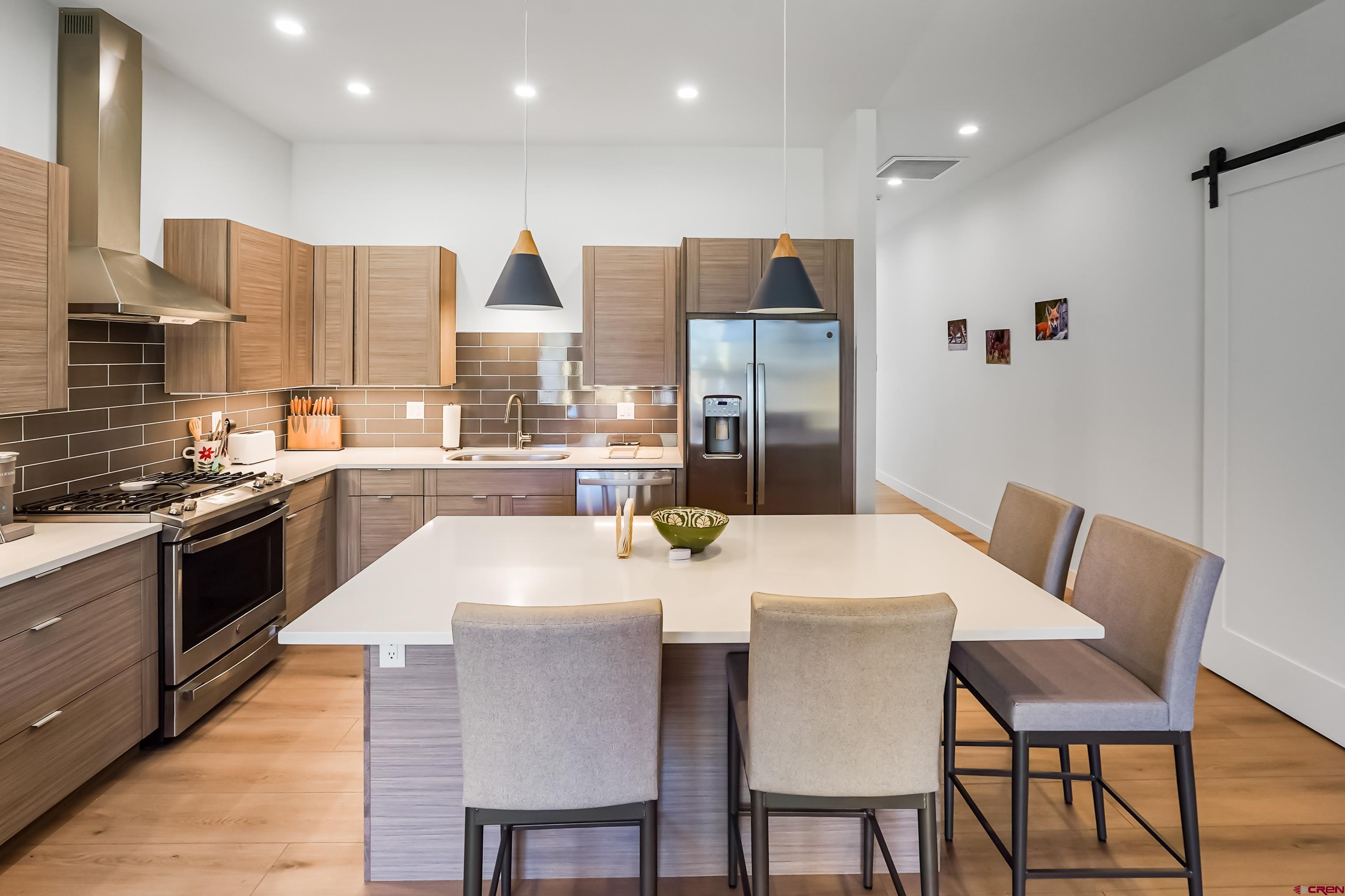 106 Elevation Drive Durango, CO 81303 - Photo 7 of 21 a large kitchen with a table and chairs