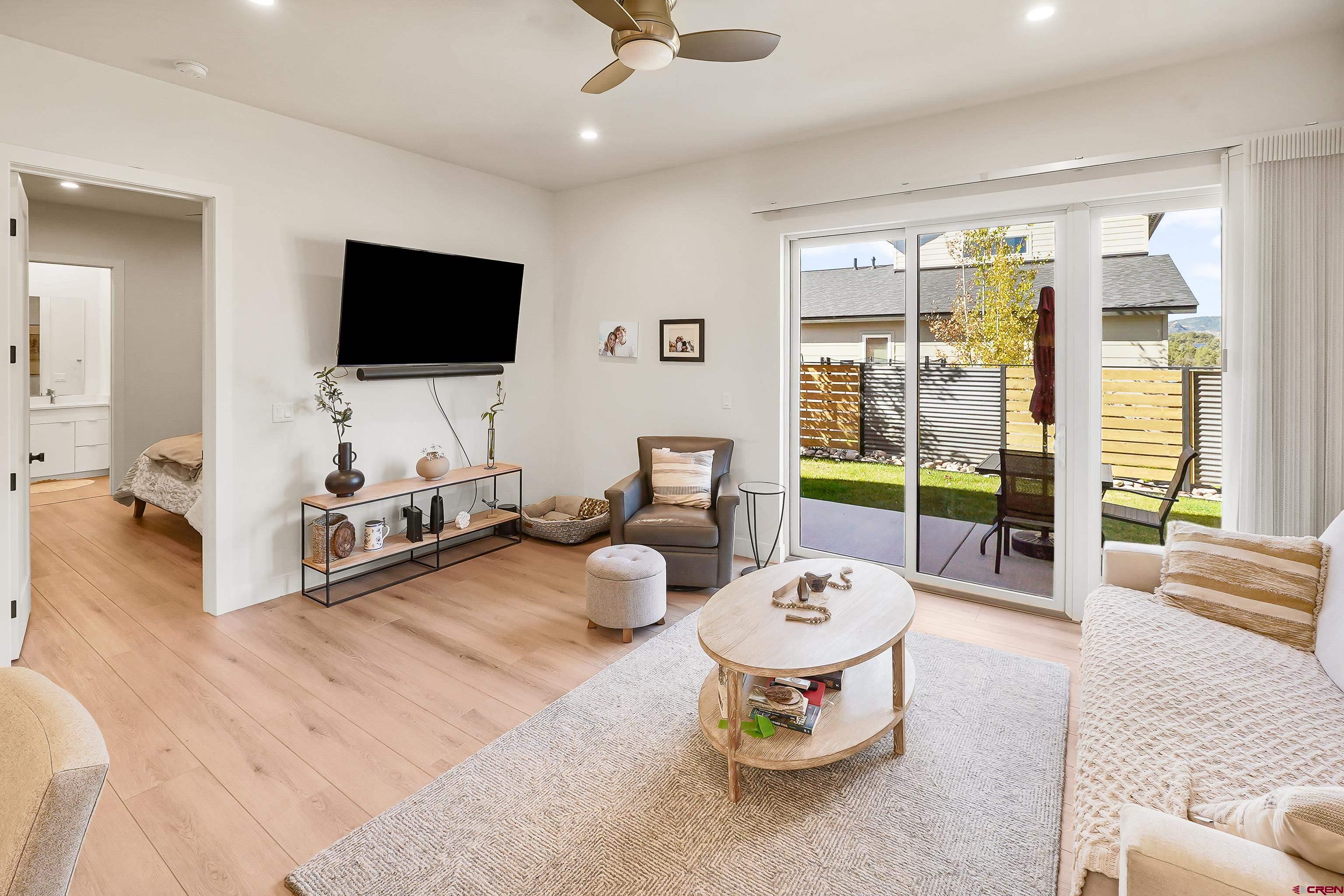 106 Elevation Drive Durango, CO 81303 - Photo 10 of 21 a living room with furniture and a flat screen tv