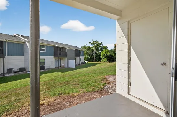 a view of a porch with a backyard