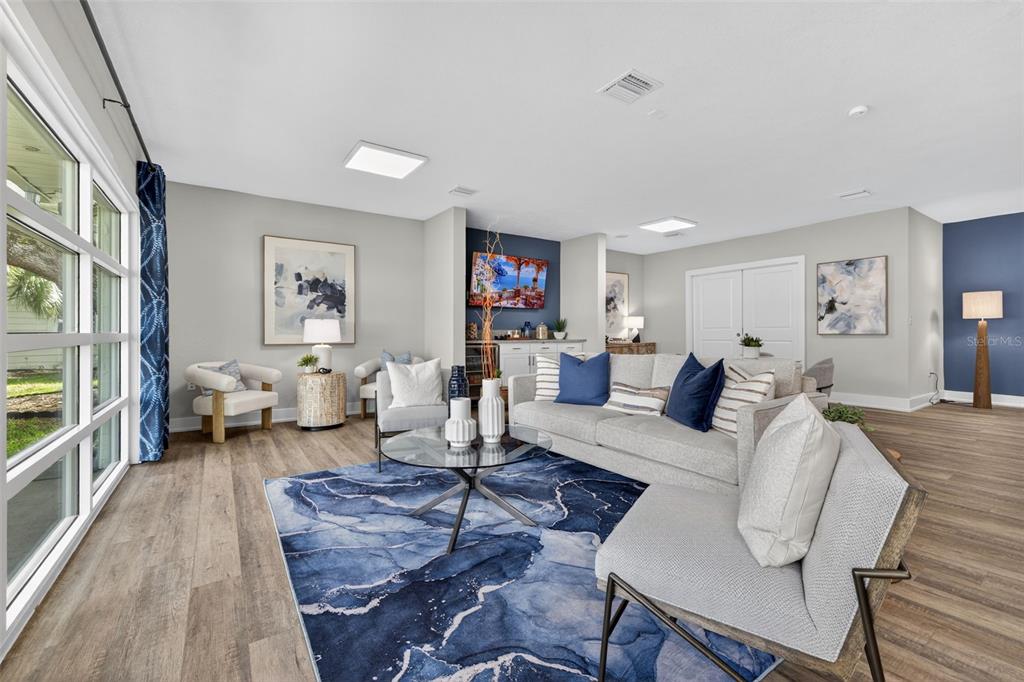 612 Bass Court, Unit 620B Dunedin, FL 34698 - Photo 21 of 32 a living room with furniture or couch and a wooden floor