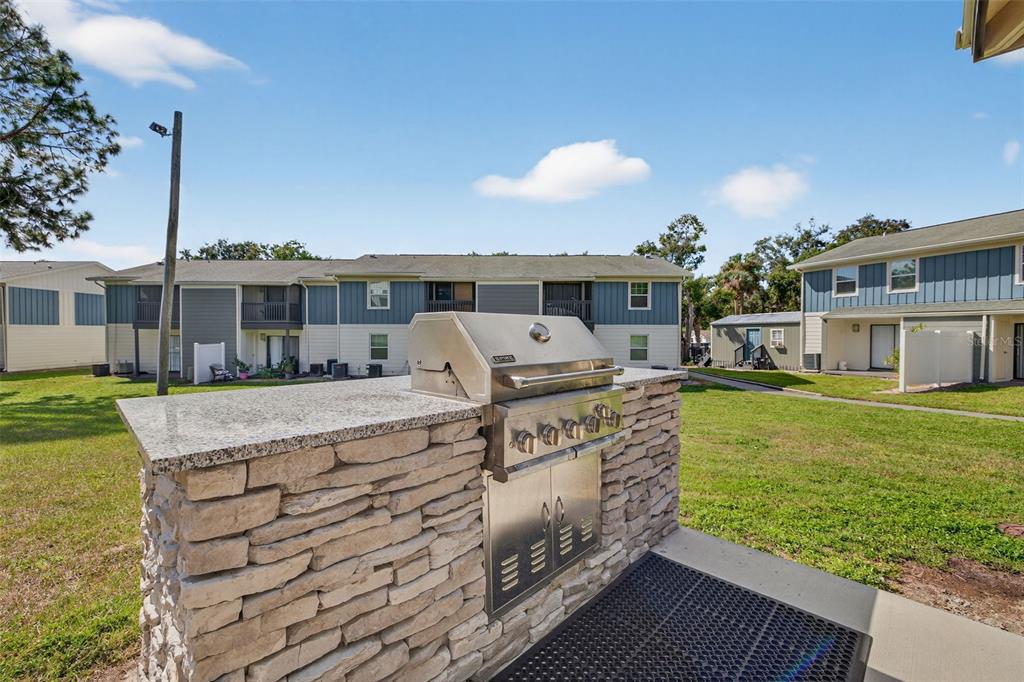 612 Bass Court, Unit 620B Dunedin, FL 34698 - Photo 31 of 32 a view of a house with a swimming pool