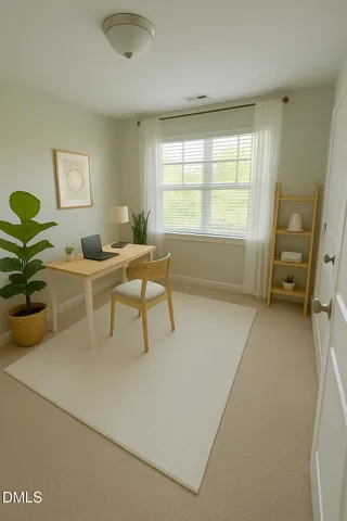 a work room with furniture and a window