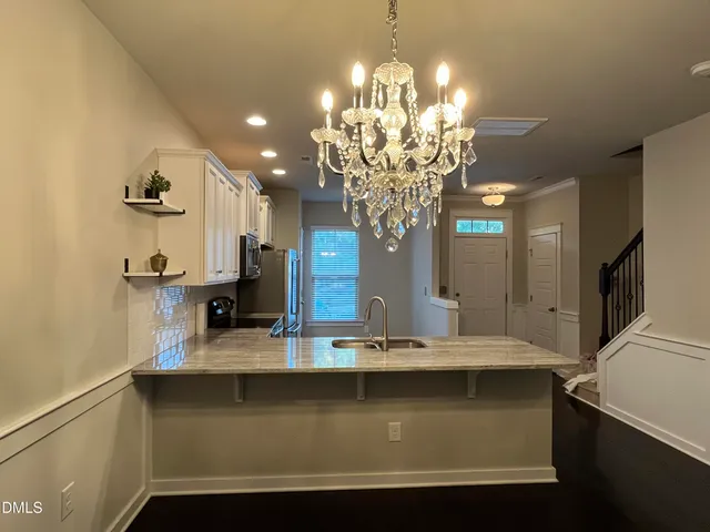 a view of a room with a chandelier