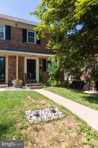 a view of a house with backyard porch and garden