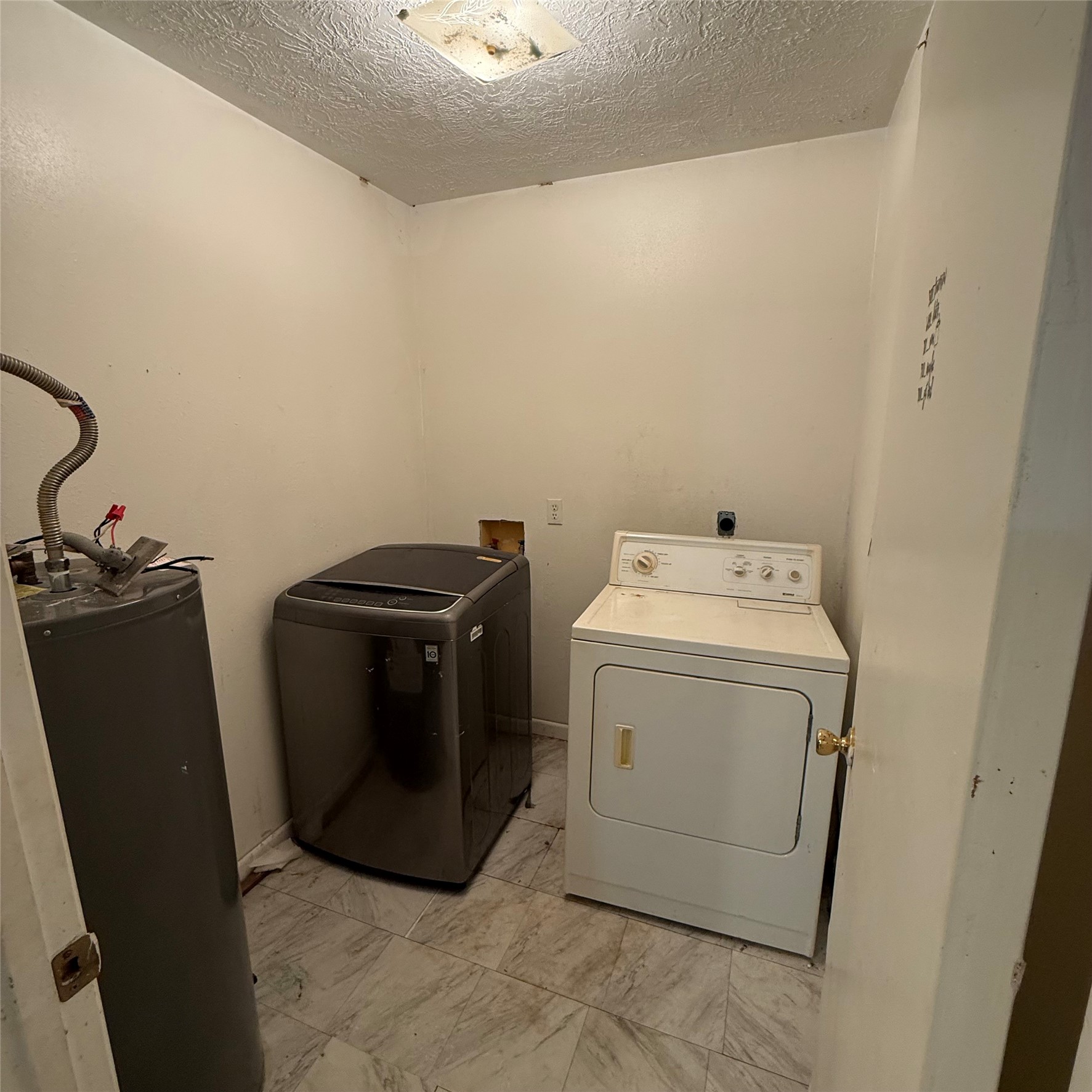 26113 Tyler Park Road Bedias, TX 77831 - Photo 12 of 24 a utility room with dryer and washer