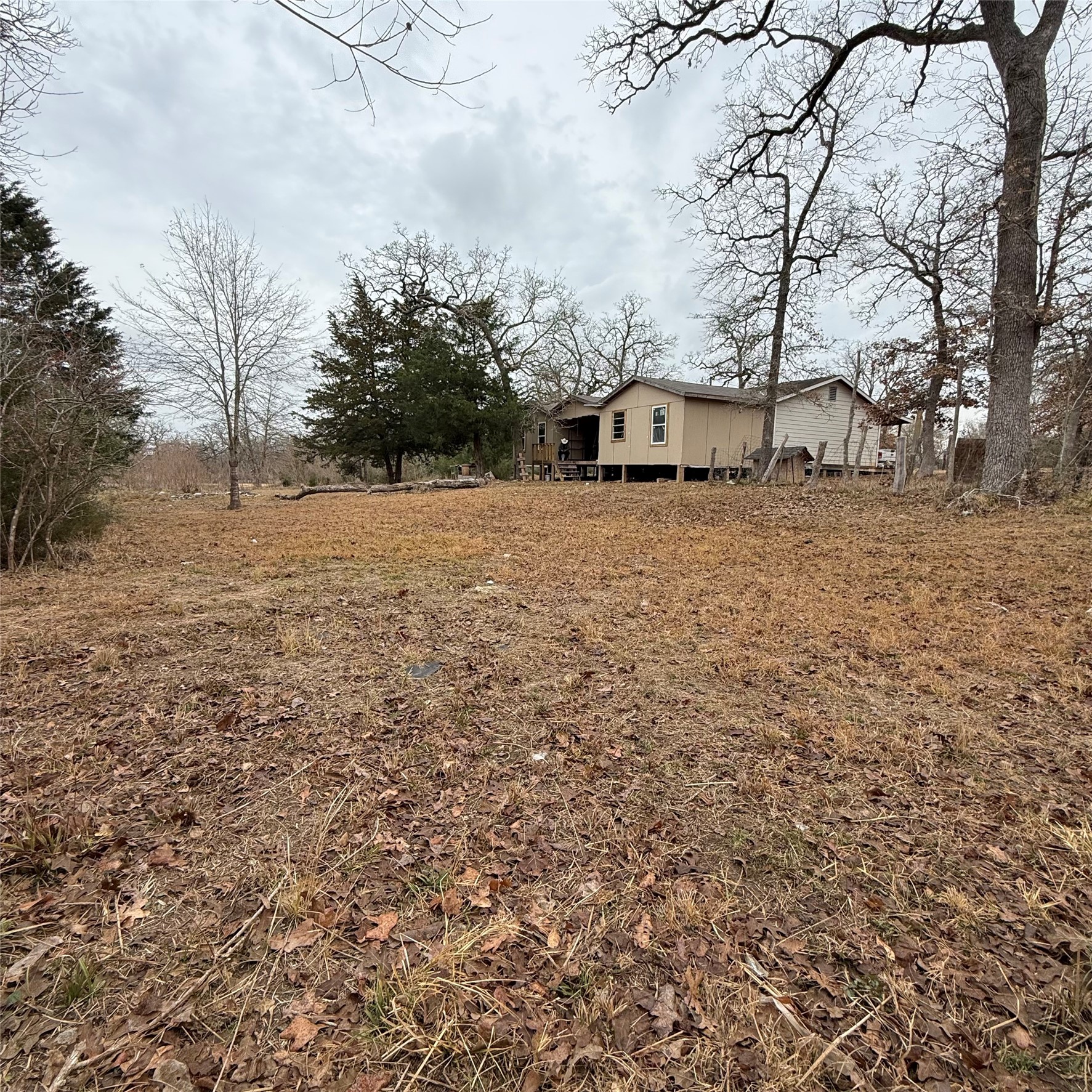 26113 Tyler Park Road Bedias, TX 77831 - Photo 18 of 24 a house view with a outdoor space