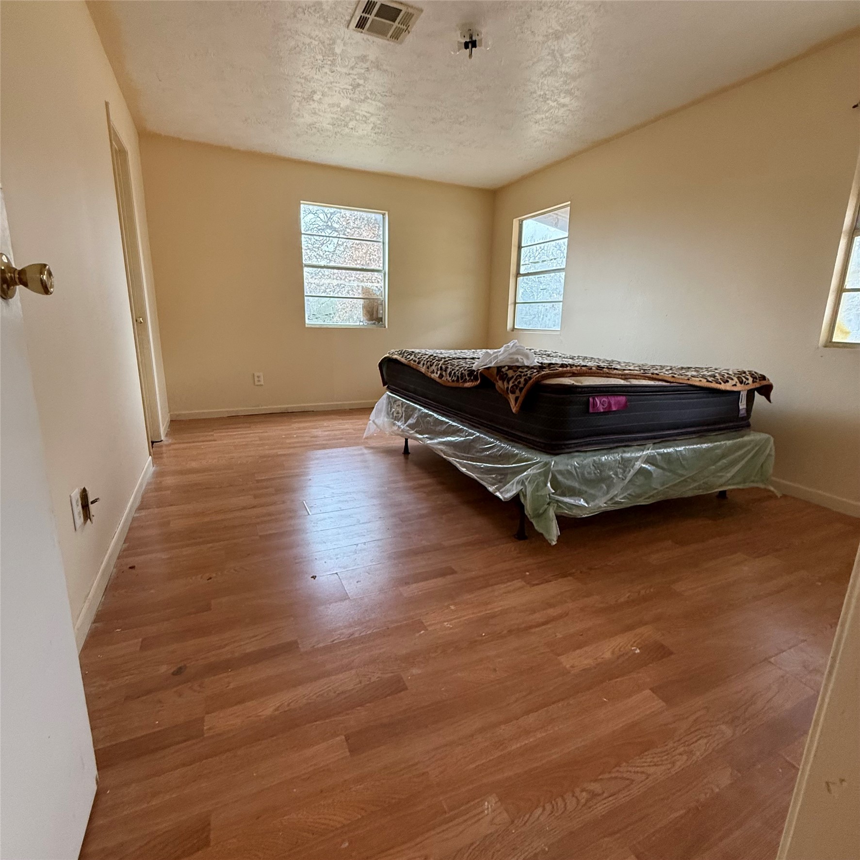 26113 Tyler Park Road Bedias, TX 77831 - Photo 21 of 24 a bedroom with furniture and window