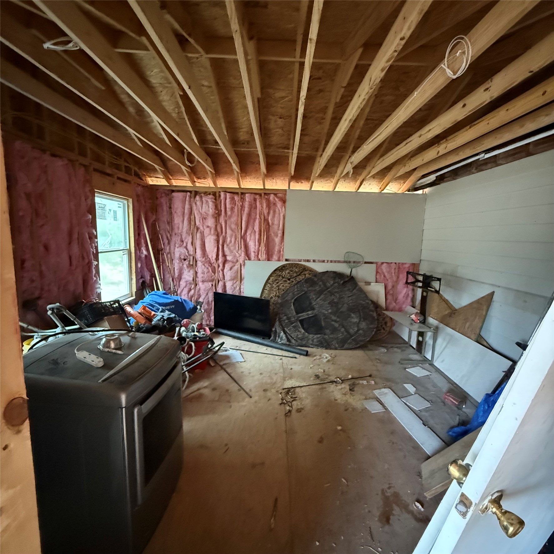 26113 Tyler Park Road Bedias, TX 77831 - Photo 24 of 24 a view of a room with storage and utility