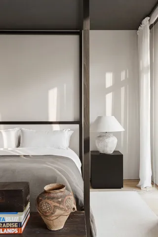 a bed room with a bed and a window