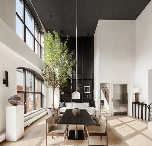 a front view of a house with outdoor seating