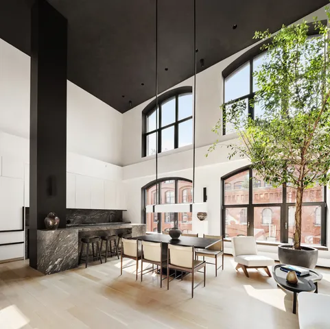 a building outdoor space with patio furniture and potted plants