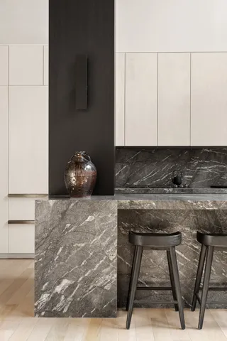 a view of kitchen island with stainless steel appliances granite countertop cabinets and stove top oven