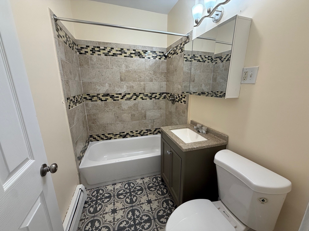 11 Dalrymple Street, Unit 3 Boston, MA 02130 - Photo 1 of 13 a white toilet sitting next to a bath tub