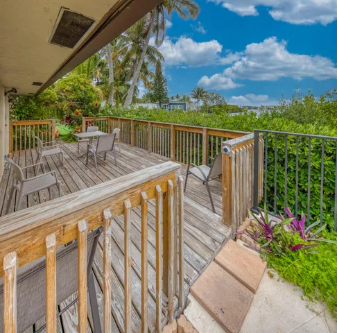 a view of a balcony with wooden floor